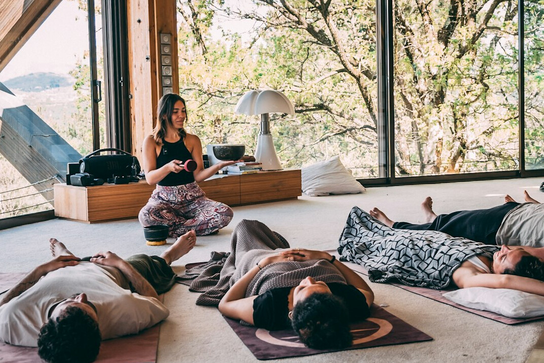 person meditating in nature