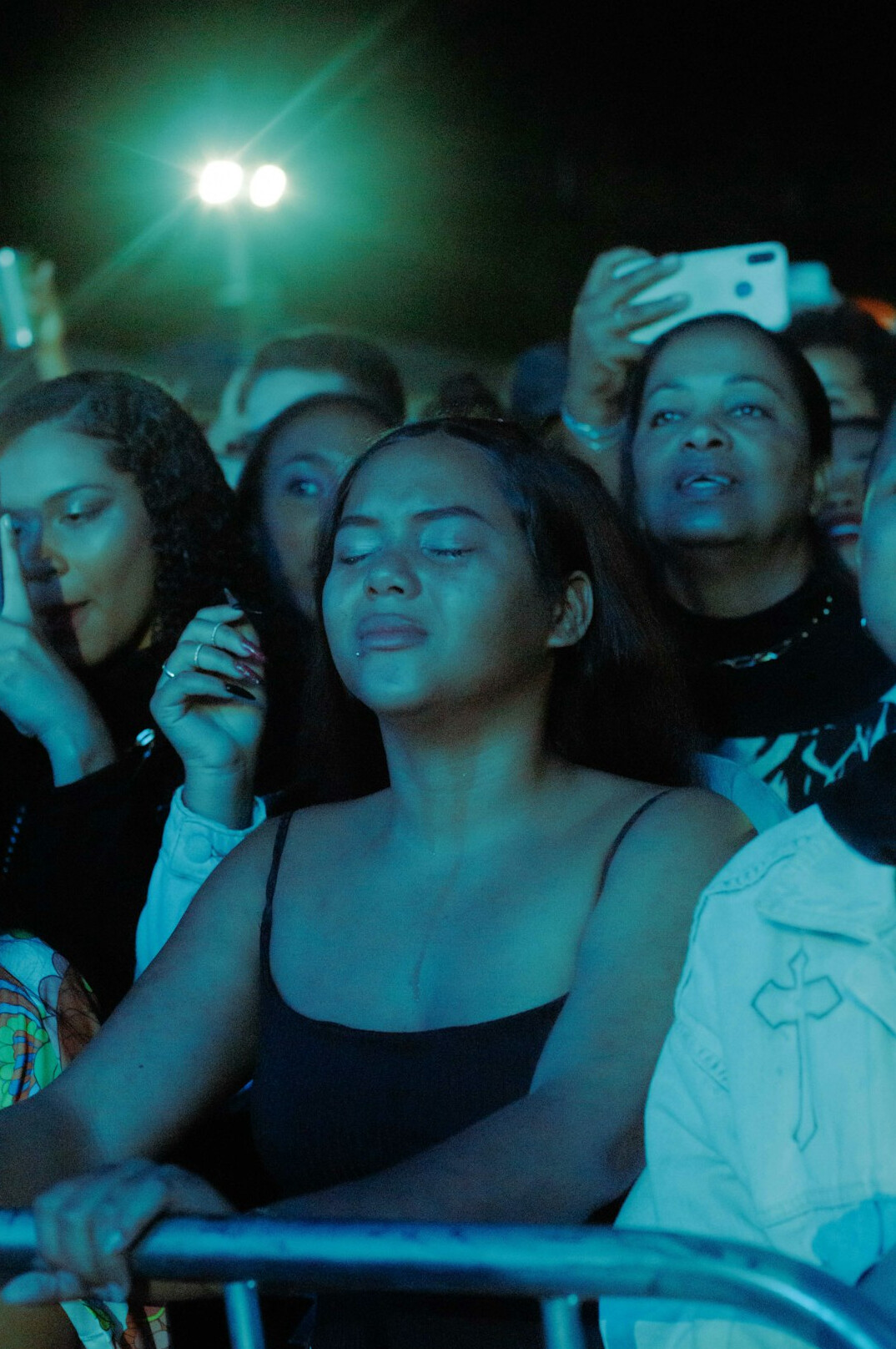 Brazilian woman speaking confidently in front of a small attentive audience