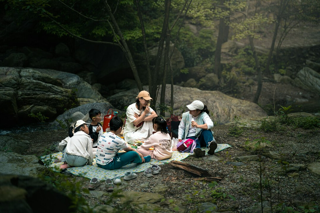 Group of brazilian people talking in a discussion circle outdoors