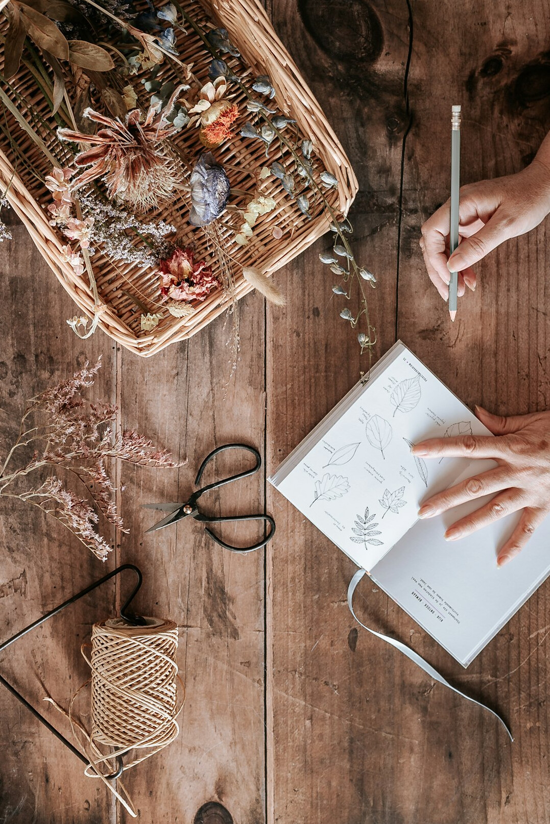 Close up of hands writing personal notes in a notebook