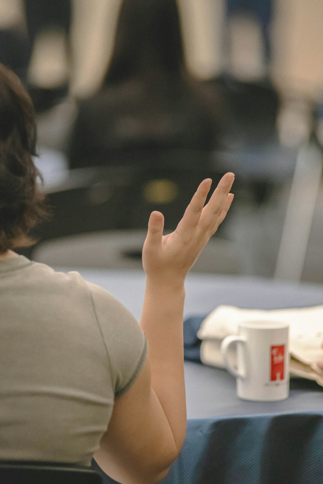 person gesturing during conversation